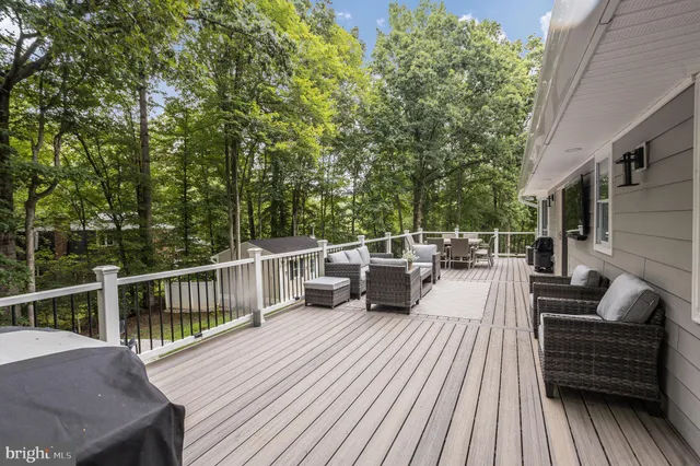 a view of a backyard with sitting area