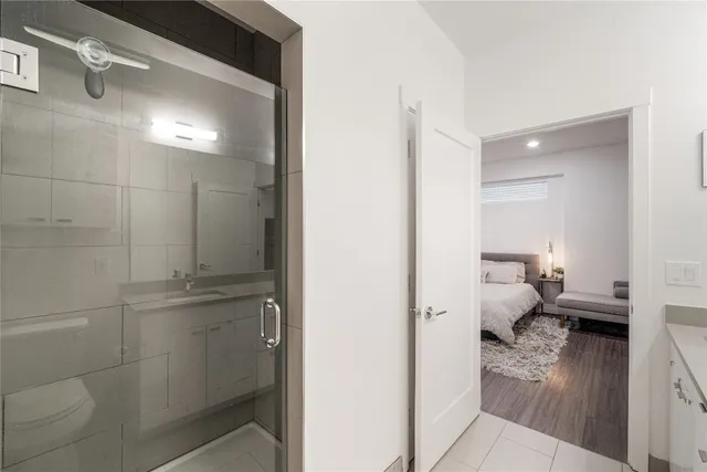 a bathroom with a toilet and a shower