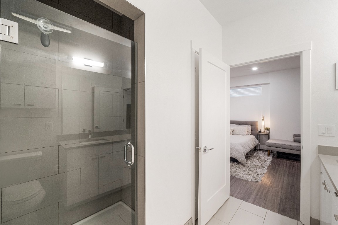 4361 South Congress Avenue, Unit 531 Austin, TX 78745 - Photo 11 of 21 a bathroom with a toilet and a shower