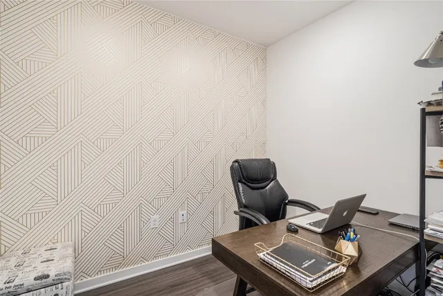 a view of workspace with wooden floor