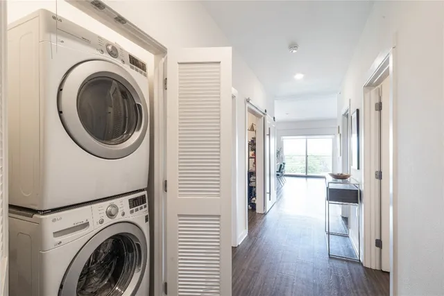 a view of a hallway with washer and dryer