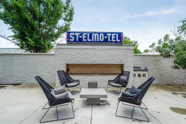 a view of a chairs and table in kitchen