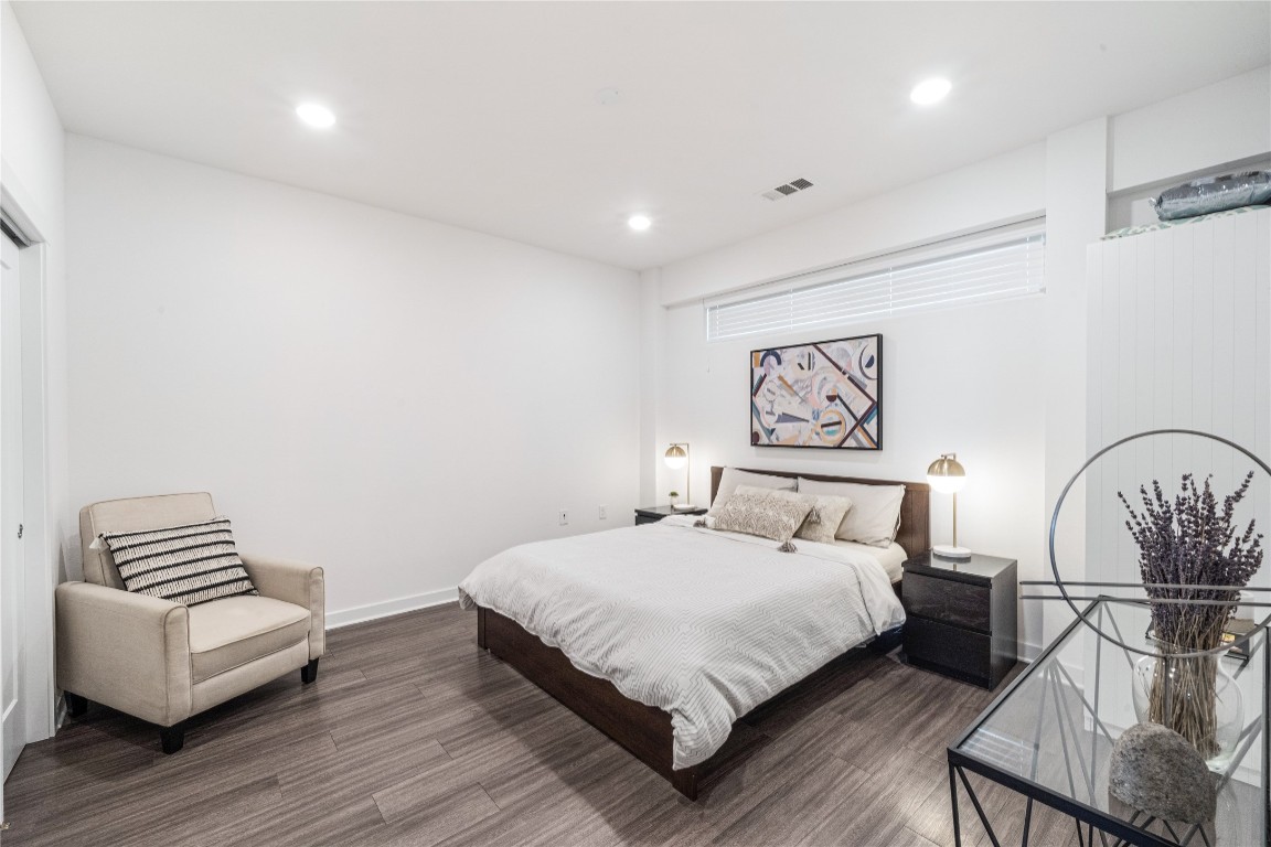 4361 South Congress Avenue, Unit 531 Austin, TX 78745 - Photo 7 of 21 a bedroom with a bed and a couch