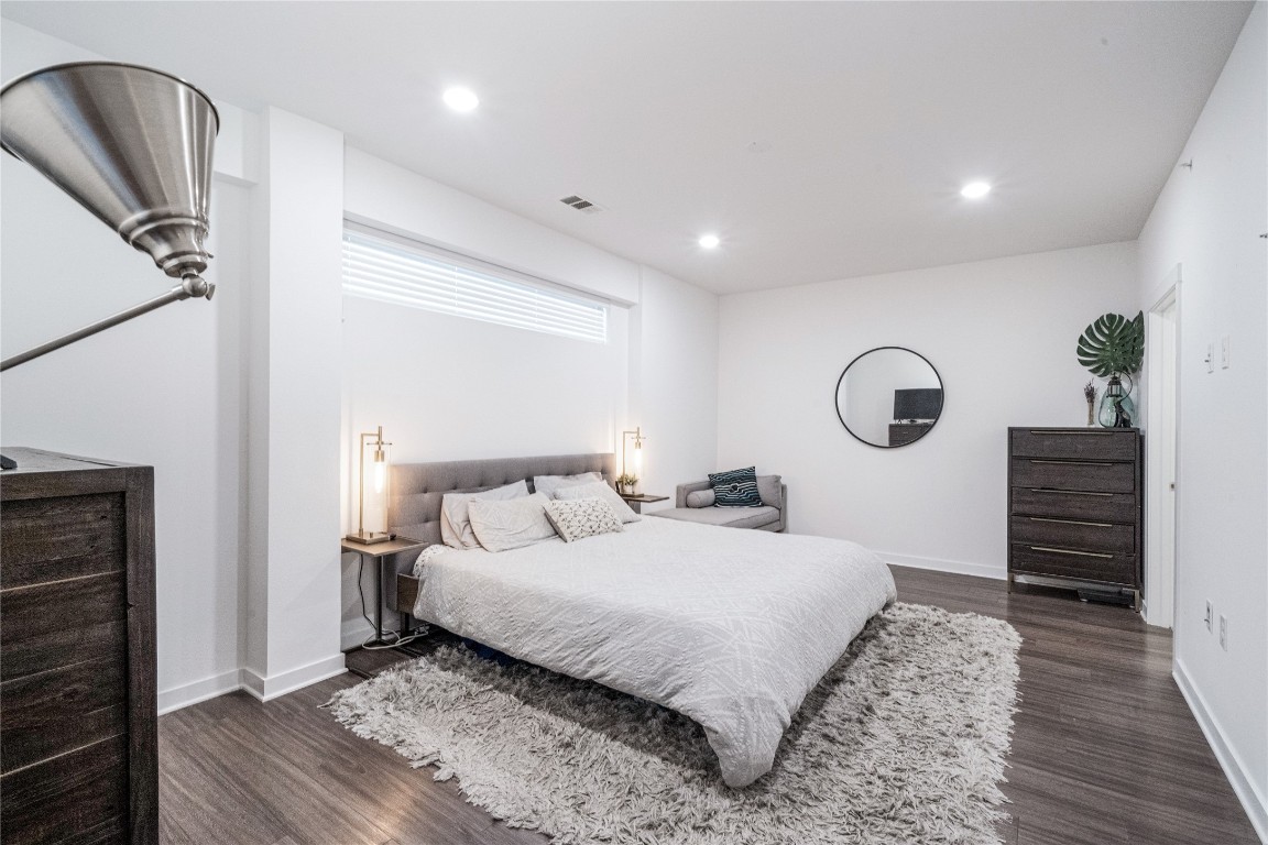 4361 South Congress Avenue, Unit 531 Austin, TX 78745 - Photo 9 of 21 a bedroom with a bed and a dresser