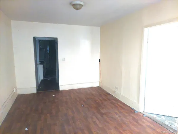 an empty room with wooden floor