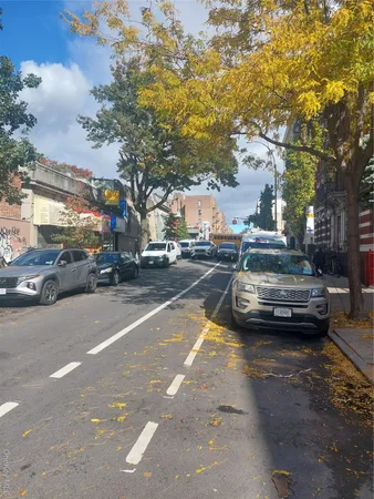 a view of street with parked cars