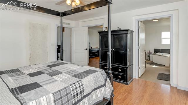 755 Edison Road Yoder, CO 80864 - Photo 14 of 29 Second View of Master Suite-Looking towards GINORMOUS-Walk in Closet/Baby Suite/Office/Sitting Room-this room is ready for your unique touches! Double doors and deck ramp provide easy access for wheelchair users.
