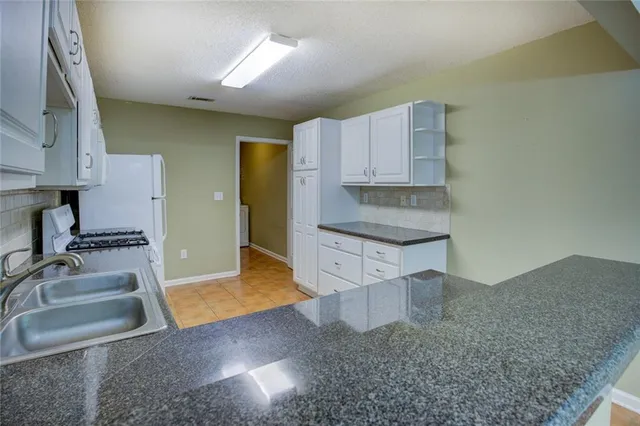 $249,900 | 2191 Rockbridge Road Southwest, Unit 102, Stone Mountain, GA 30087