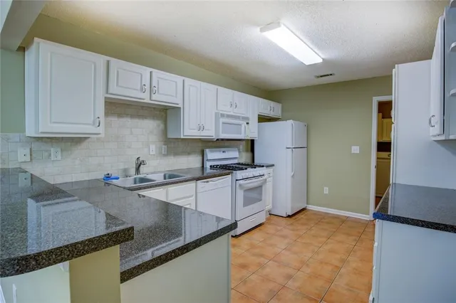 $249,900 | 2191 Rockbridge Road Southwest, Unit 102, Stone Mountain, GA 30087