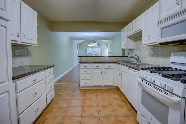 $249,900 | 2191 Rockbridge Road Southwest, Unit 102, Stone Mountain, GA 30087