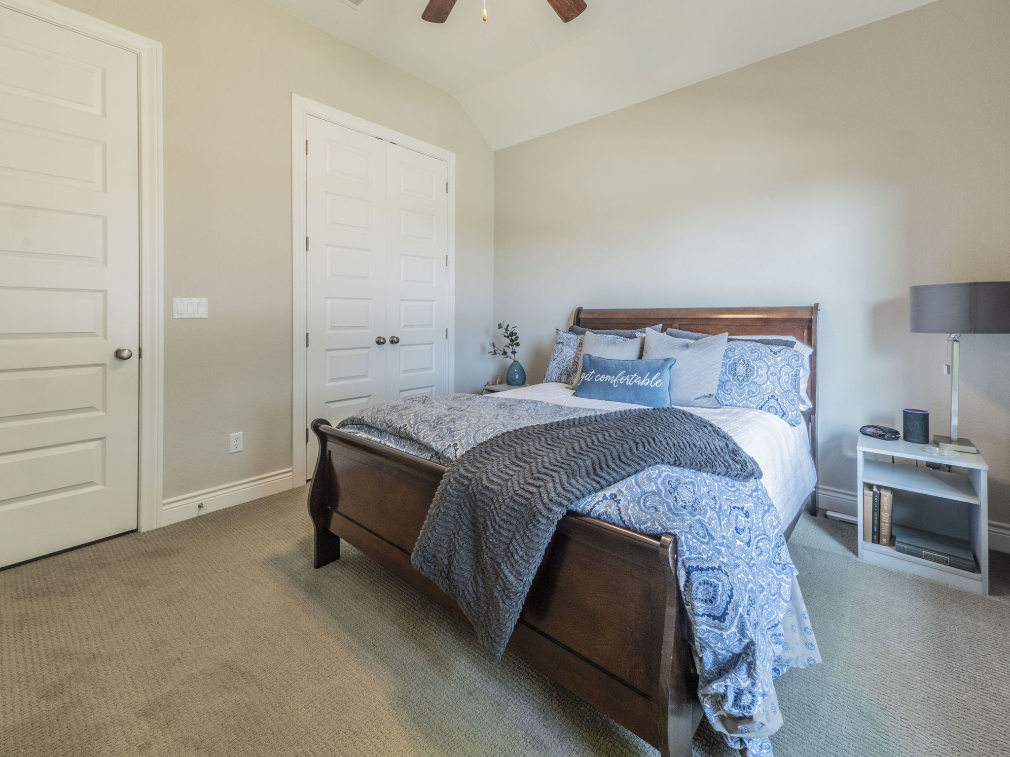 205 Standing Oak Drive Georgetown, TX 78633 - Photo 18 of 40 Carpeted bedroom featuring a closet, vaulted ceiling, and ceiling fan