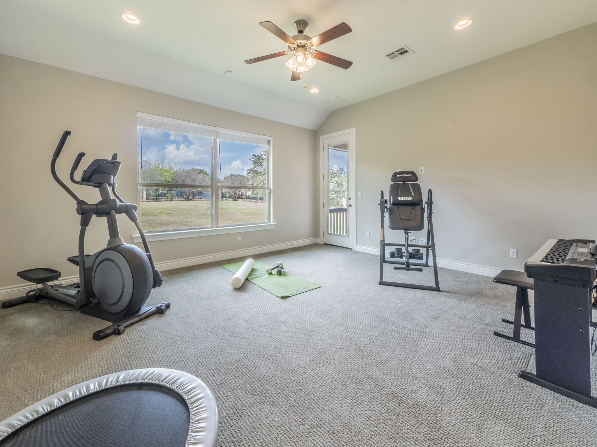 205 Standing Oak Drive Georgetown, TX 78633 - Photo 21 of 40 Exercise area with recessed lighting, lofted ceiling, ceiling fan, and carpet floors