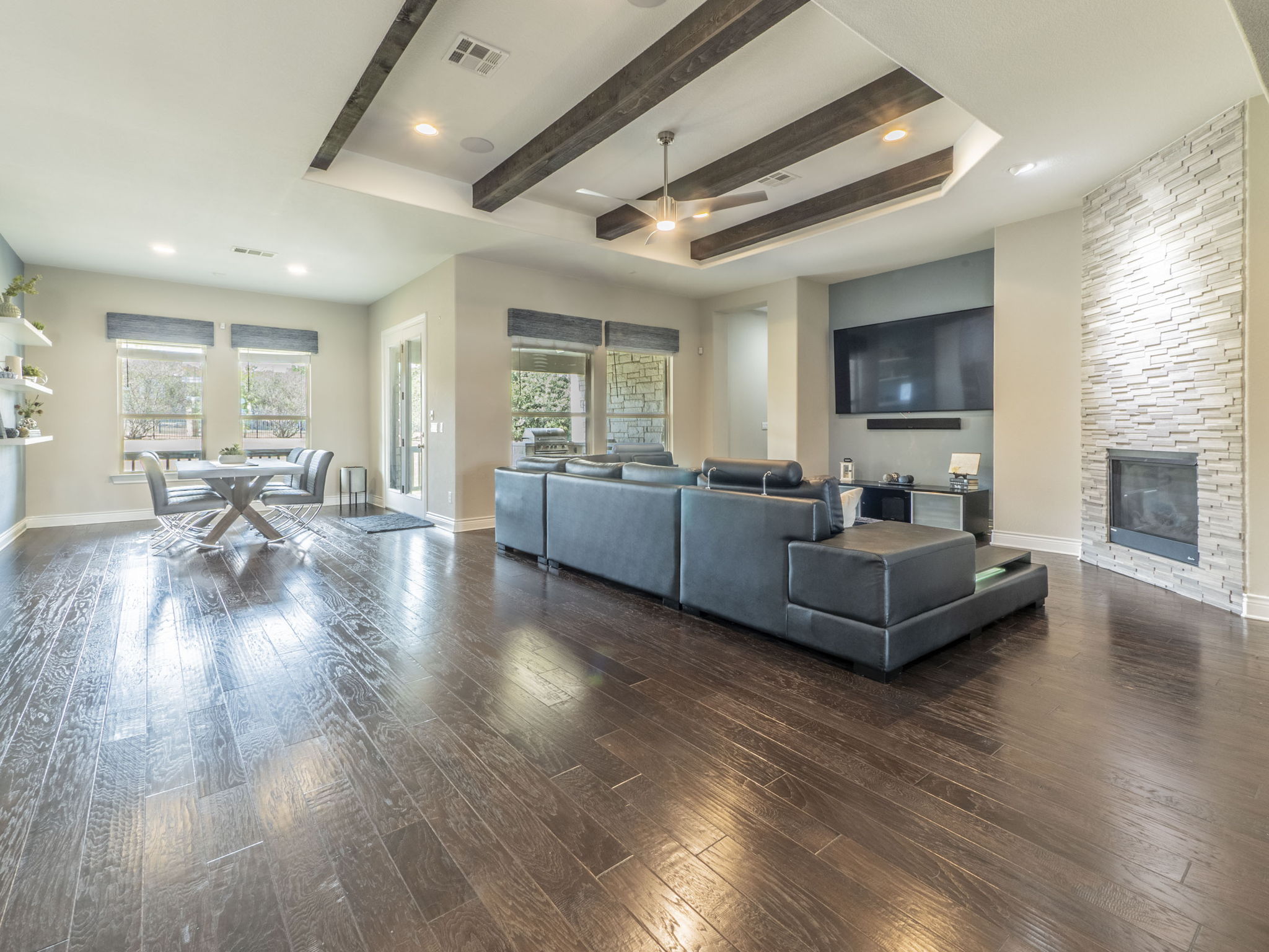 205 Standing Oak Drive Georgetown, TX 78633 - Photo 5 of 40 Great open space w/living area, dark wood finished floors, beautifully beamed ceiling, cozy fireplace, and recessed lighting