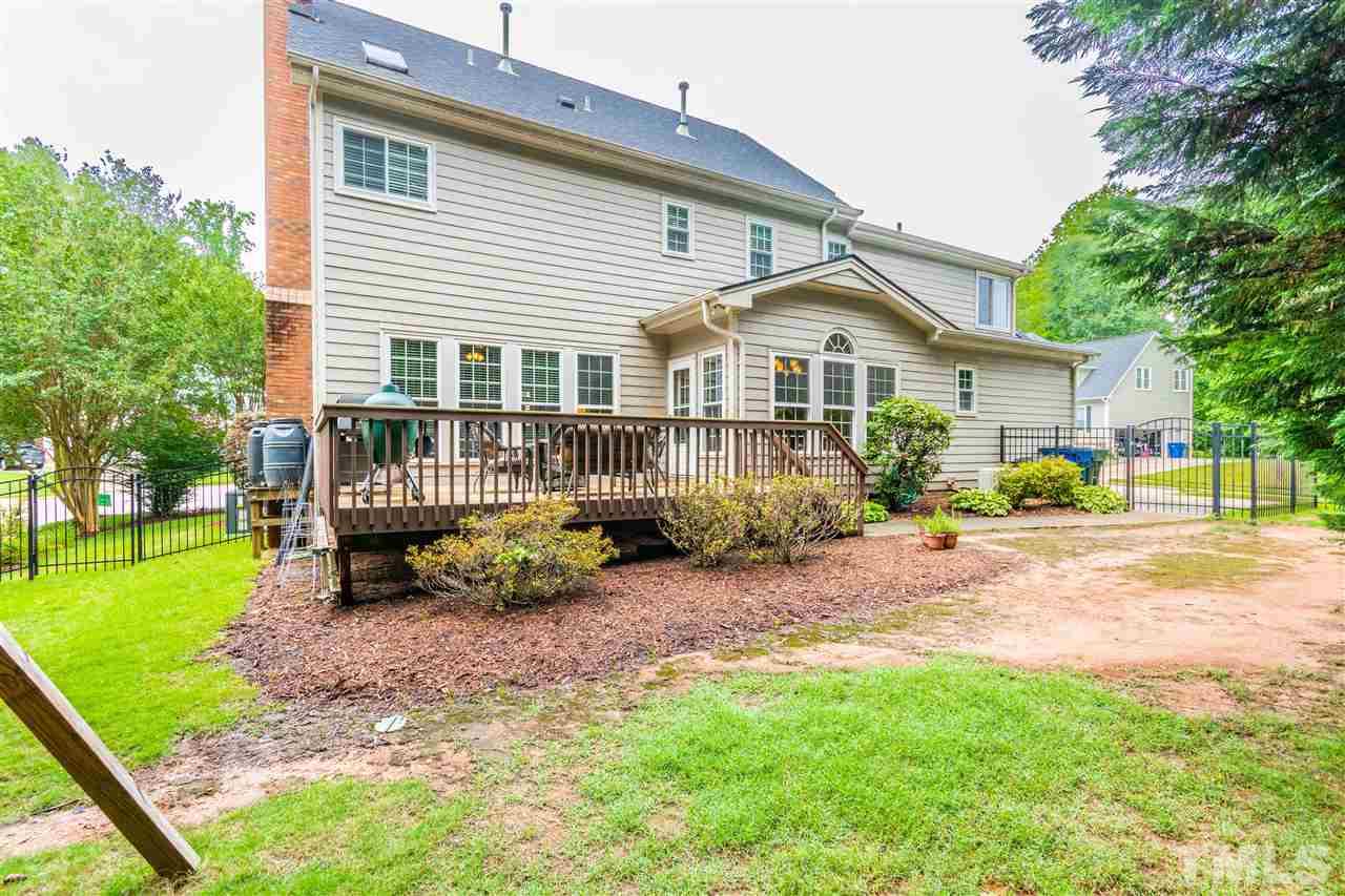 8108 Fallston Court Raleigh, NC 27613 - Photo 2 of 23 a view of a house with a yard chairs and a patio