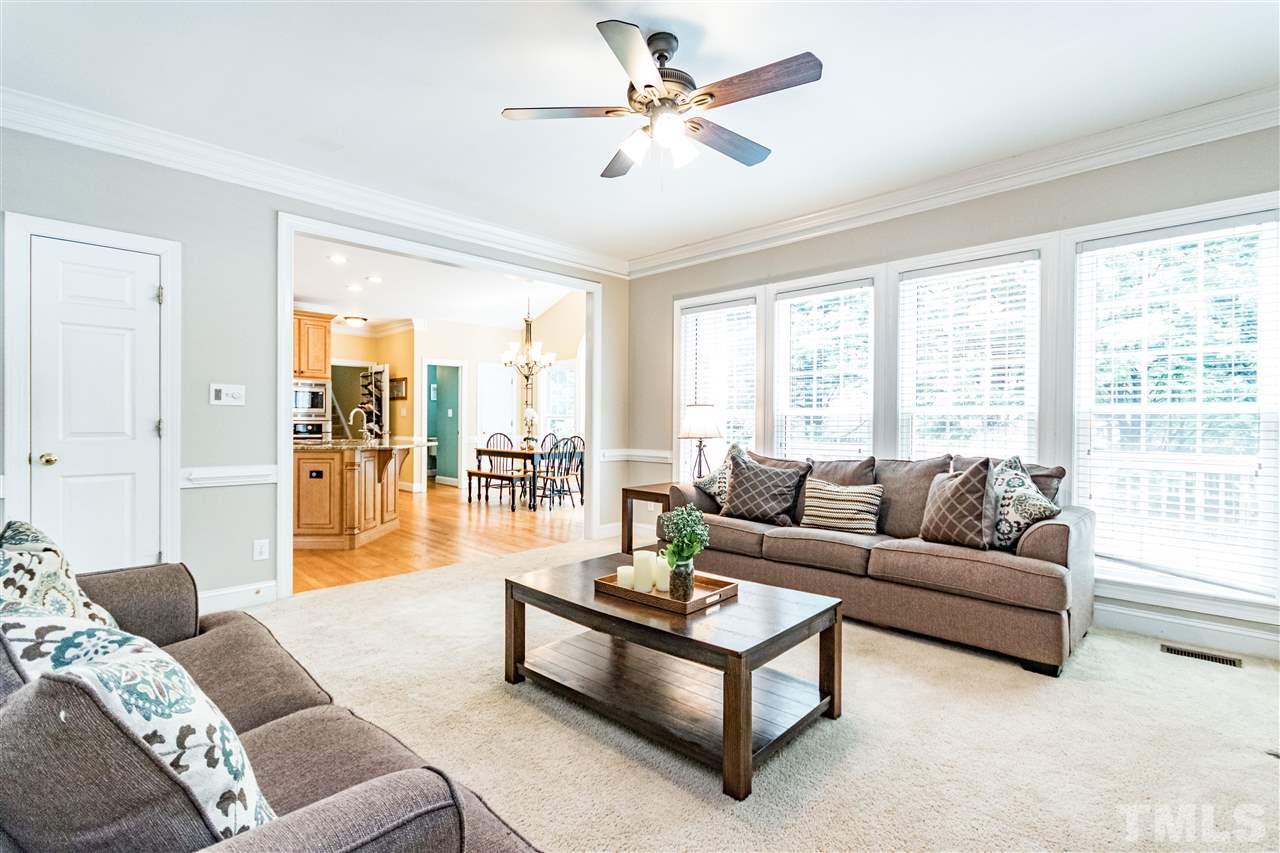 8108 Fallston Court Raleigh, NC 27613 - Photo 11 of 23 a living room with furniture and a large window