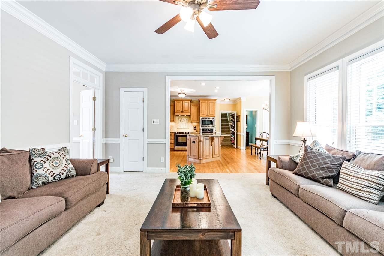 8108 Fallston Court Raleigh, NC 27613 - Photo 12 of 23 a living room with furniture and a large window