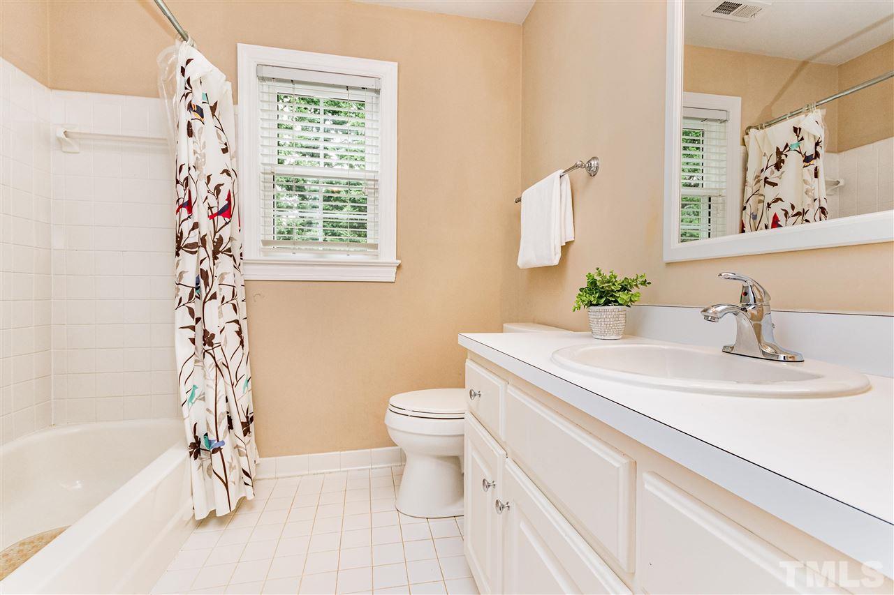 8108 Fallston Court Raleigh, NC 27613 - Photo 18 of 23 a bathroom with a sink a toilet and a bathtub
