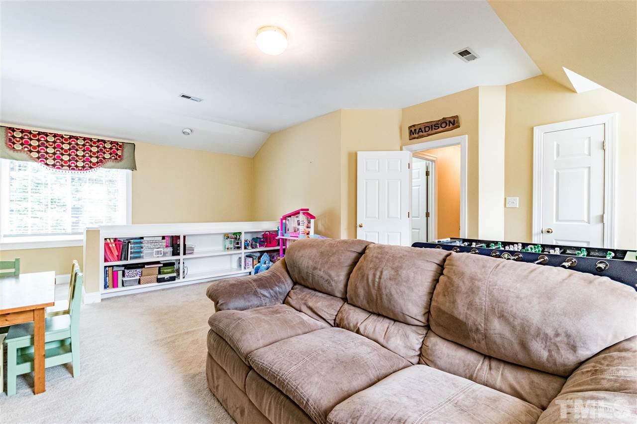 8108 Fallston Court Raleigh, NC 27613 - Photo 22 of 23 a living room with furniture