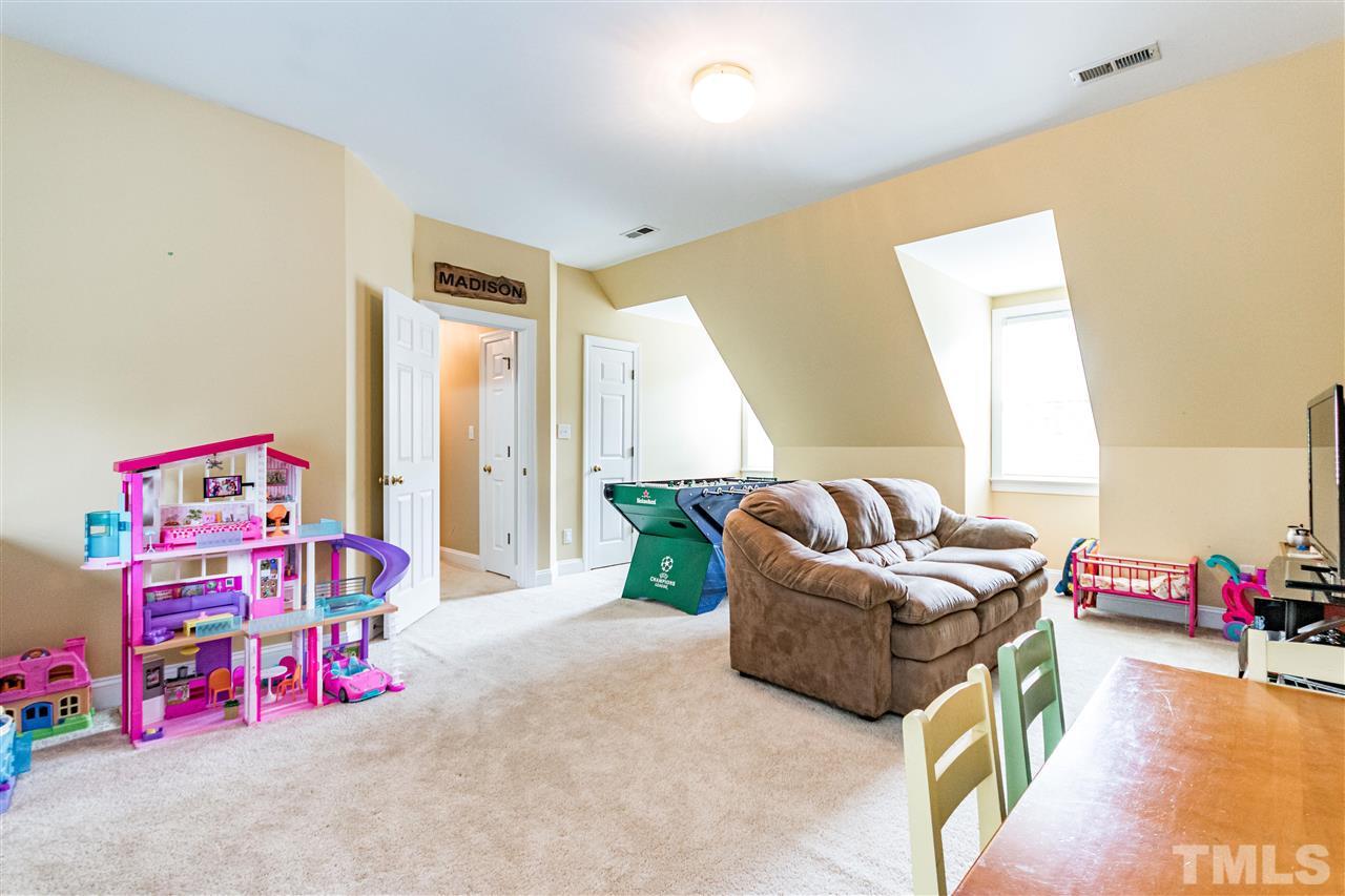 8108 Fallston Court Raleigh, NC 27613 - Photo 23 of 23 a living room with furniture and a couch
