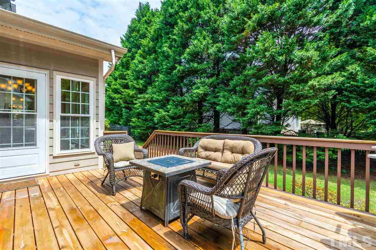 8108 Fallston Court Raleigh, NC 27613 - Photo 4 of 23 a view of balcony with wooden floor and outdoor seating