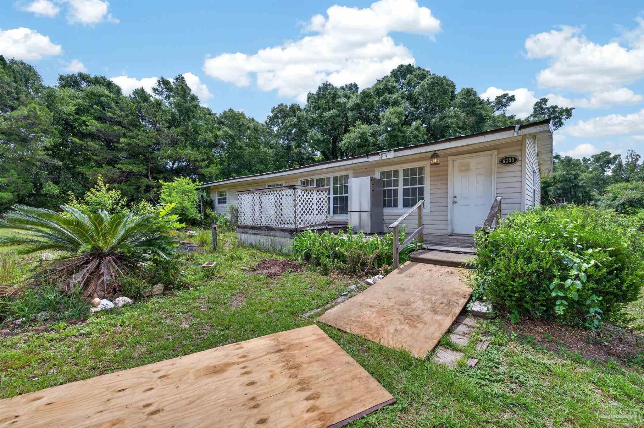 6253 Allentown Road Milton, FL 32570 - Photo 28 of 31 a view of a backyard with plants