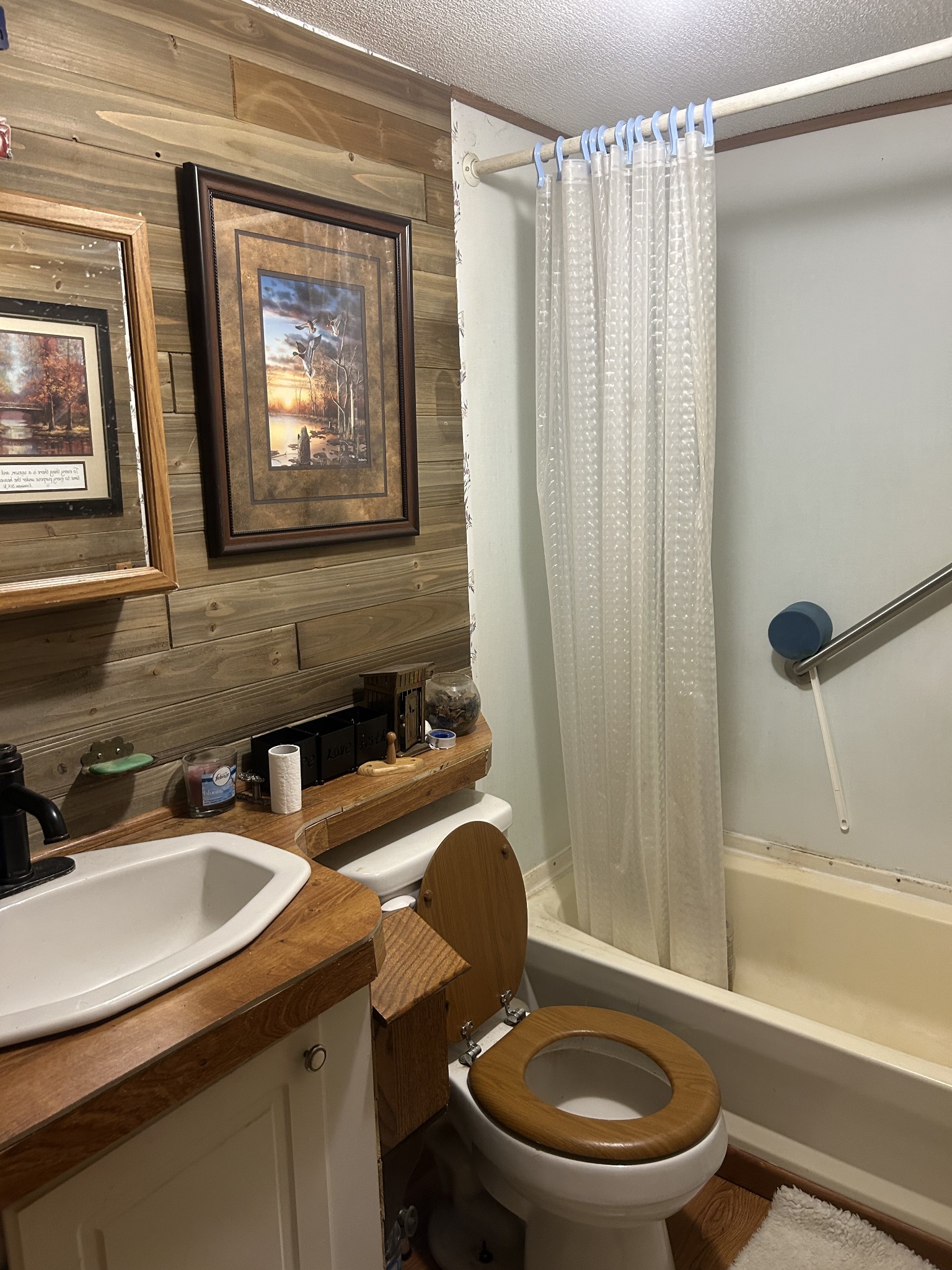 160 Wilson Cemetery Road Big Sandy, TN 38221 - Photo 14 of 20 a bathroom with a sink toilet and shower