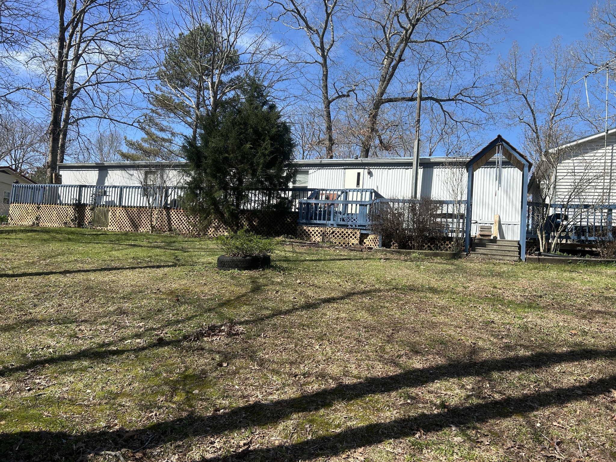 160 Wilson Cemetery Road Big Sandy, TN 38221 - Photo 2 of 20 a view of a yard with a tree