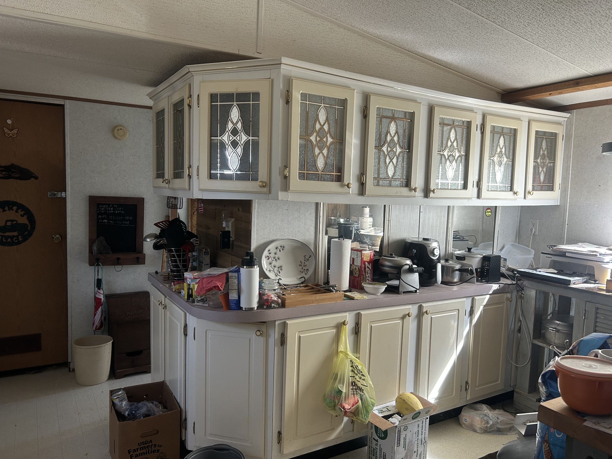 160 Wilson Cemetery Road Big Sandy, TN 38221 - Photo 8 of 20 a kitchen with a sink appliances and cabinets