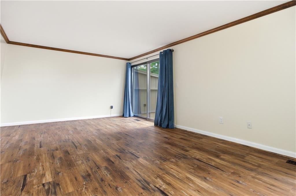 146 Locust Court Pittsburgh, PA 15237 - Photo 11 of 32 a view of an empty room with wooden floor and a window
