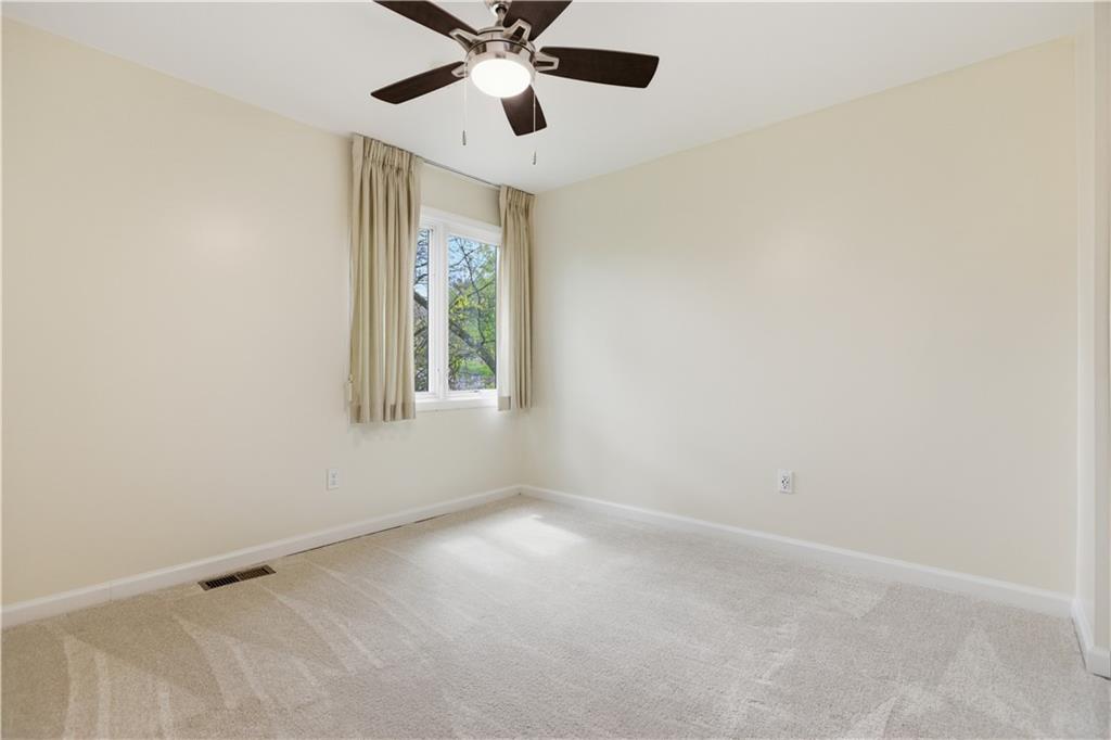 146 Locust Court Pittsburgh, PA 15237 - Photo 17 of 32 an empty room with windows and fan
