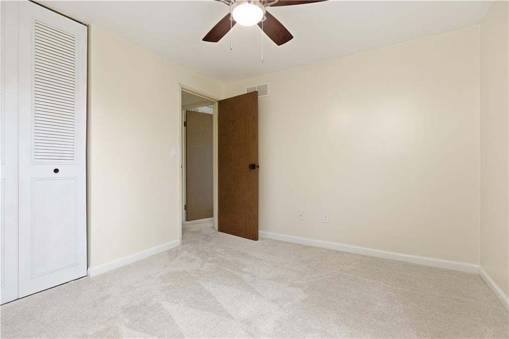 146 Locust Court Pittsburgh, PA 15237 - Photo 18 of 32 an empty room with a ceiling fan and carpet