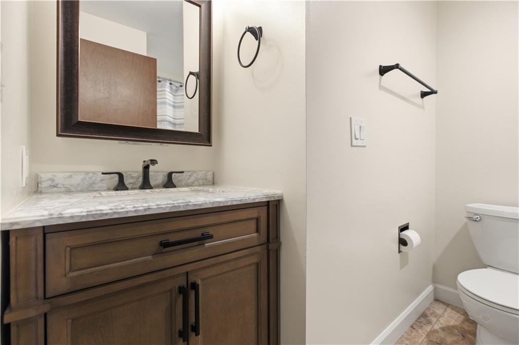 146 Locust Court Pittsburgh, PA 15237 - Photo 20 of 32 a bathroom with a granite countertop toilet sink and mirror