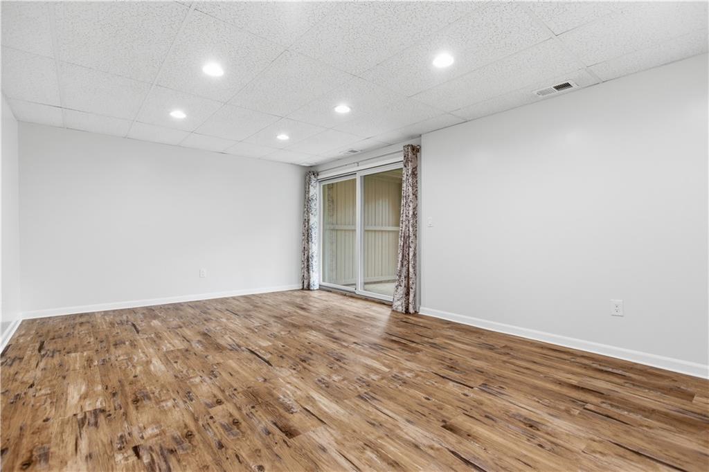 146 Locust Court Pittsburgh, PA 15237 - Photo 23 of 32 a view of an empty room with wooden floor and a window