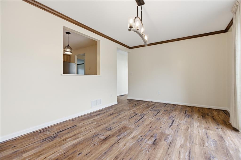 146 Locust Court Pittsburgh, PA 15237 - Photo 6 of 32 a view of empty room with wooden floor and fan