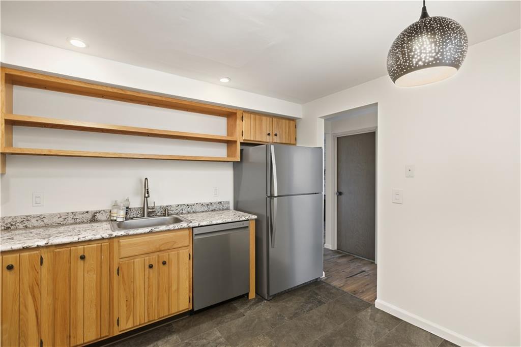 146 Locust Court Pittsburgh, PA 15237 - Photo 7 of 32 a kitchen with a sink a refrigerator and cabinets