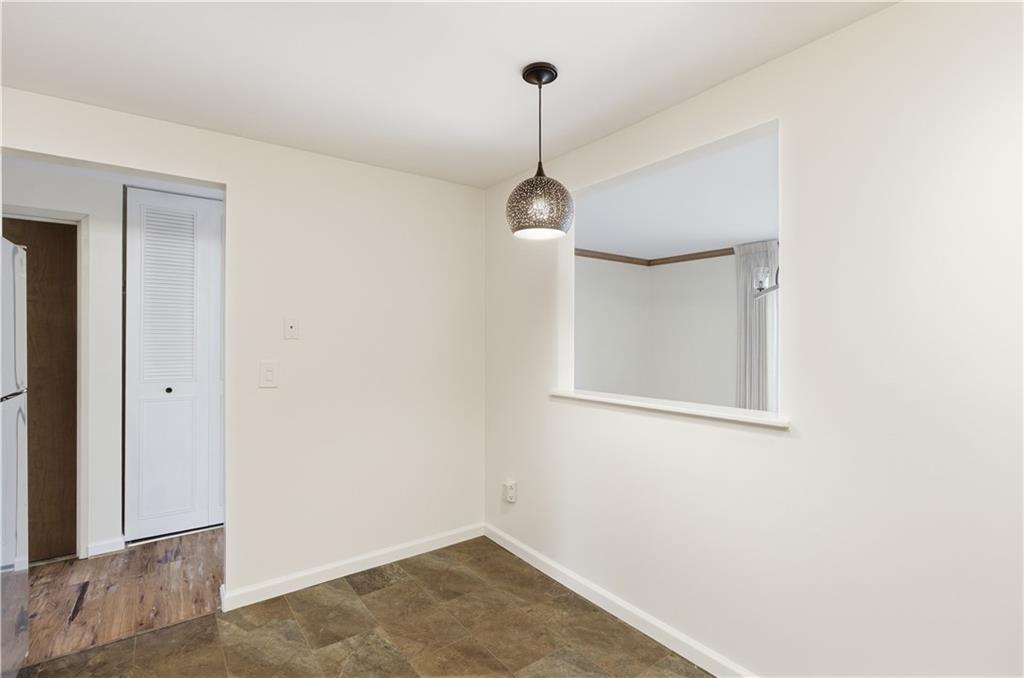 146 Locust Court Pittsburgh, PA 15237 - Photo 9 of 32 a view of a hallway with a chandelier fan and wooden floor