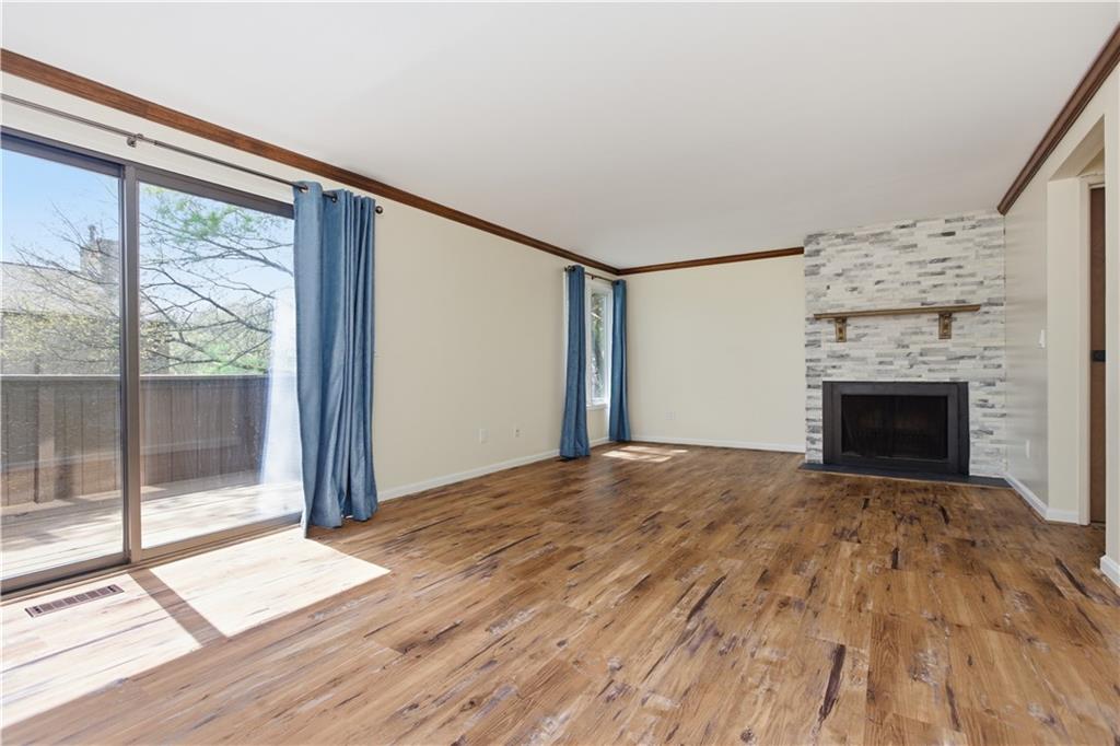 146 Locust Court Pittsburgh, PA 15237 - Photo 10 of 32 a view of empty room with wooden floor and fireplace