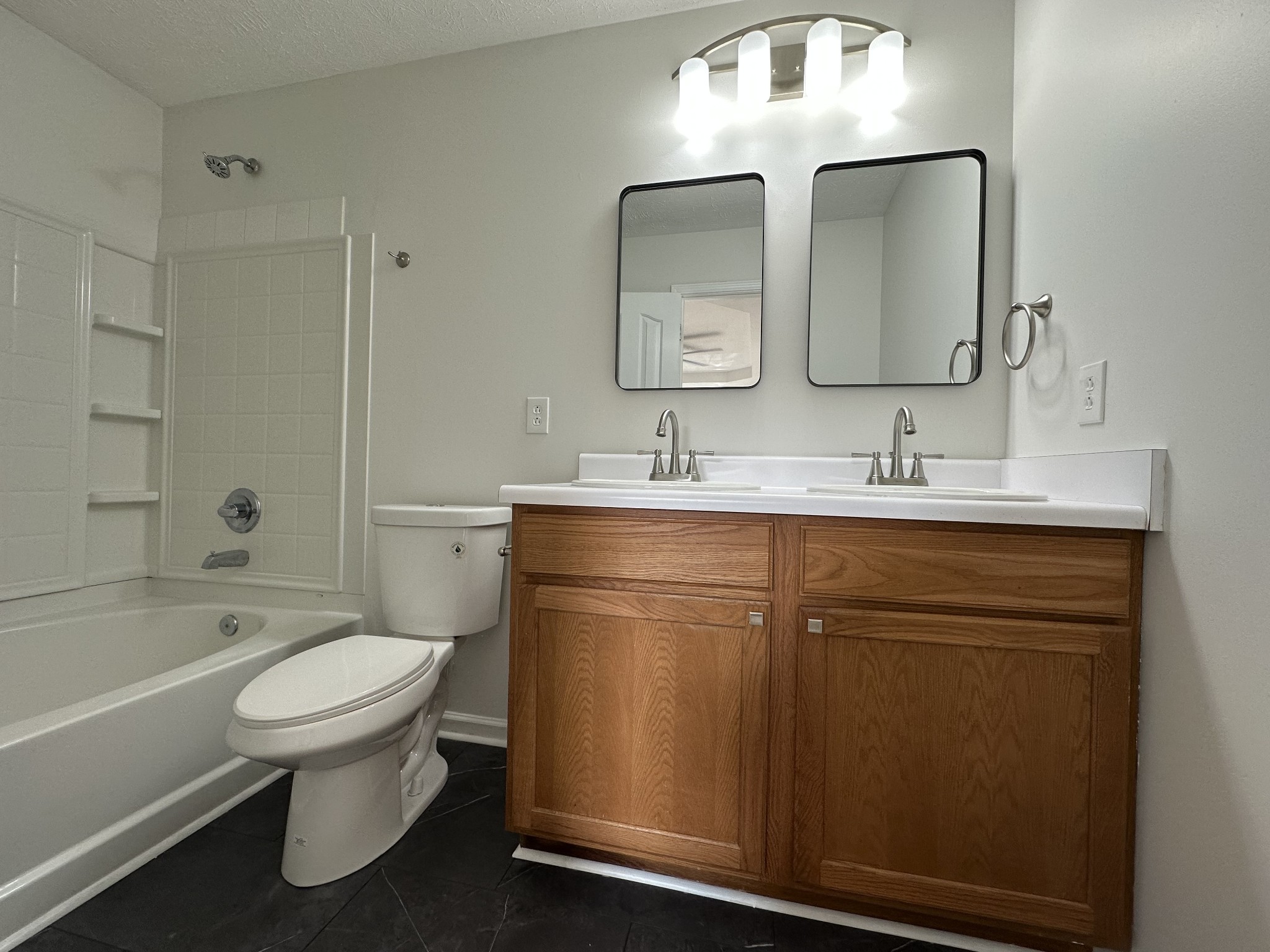 202 Latimer Drive Smyrna, TN 37167 - Photo 13 of 30 a bathroom with a double vanity sink toilet mirror and bathtub