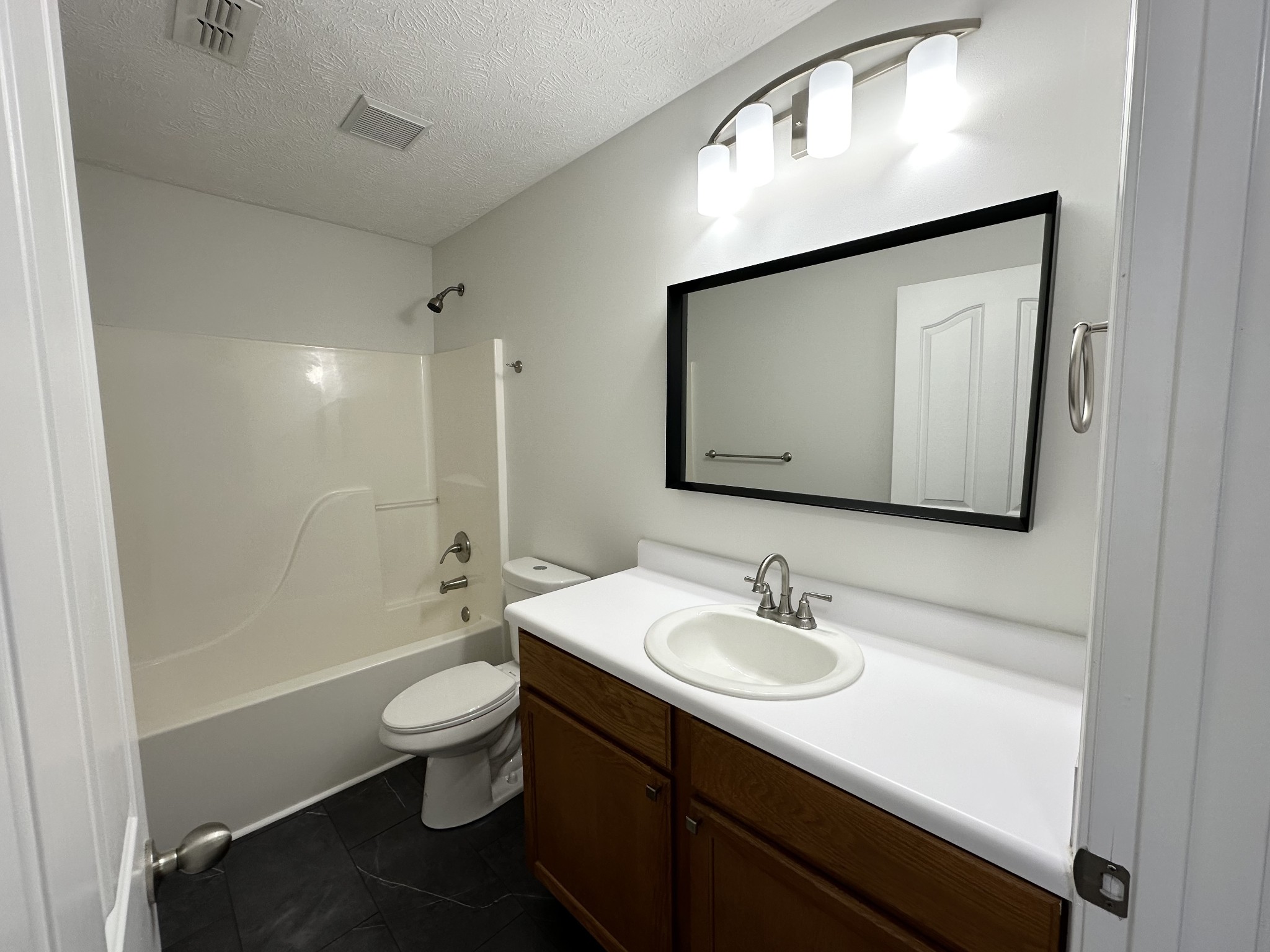 202 Latimer Drive Smyrna, TN 37167 - Photo 19 of 30 a bathroom with a sink a toilet and shower a mirror