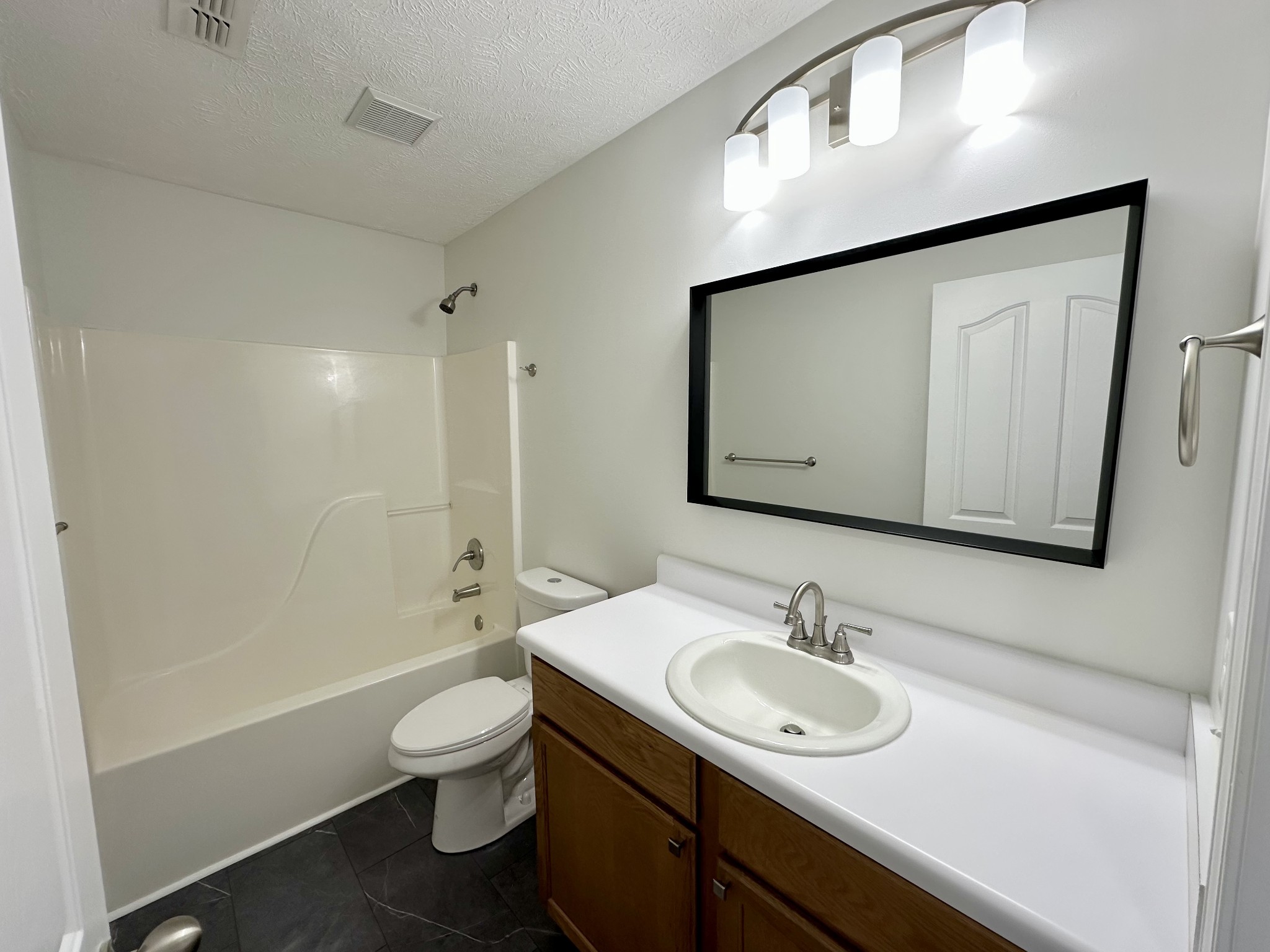 202 Latimer Drive Smyrna, TN 37167 - Photo 20 of 30 a bathroom with a toilet a sink a mirror and a bathtub