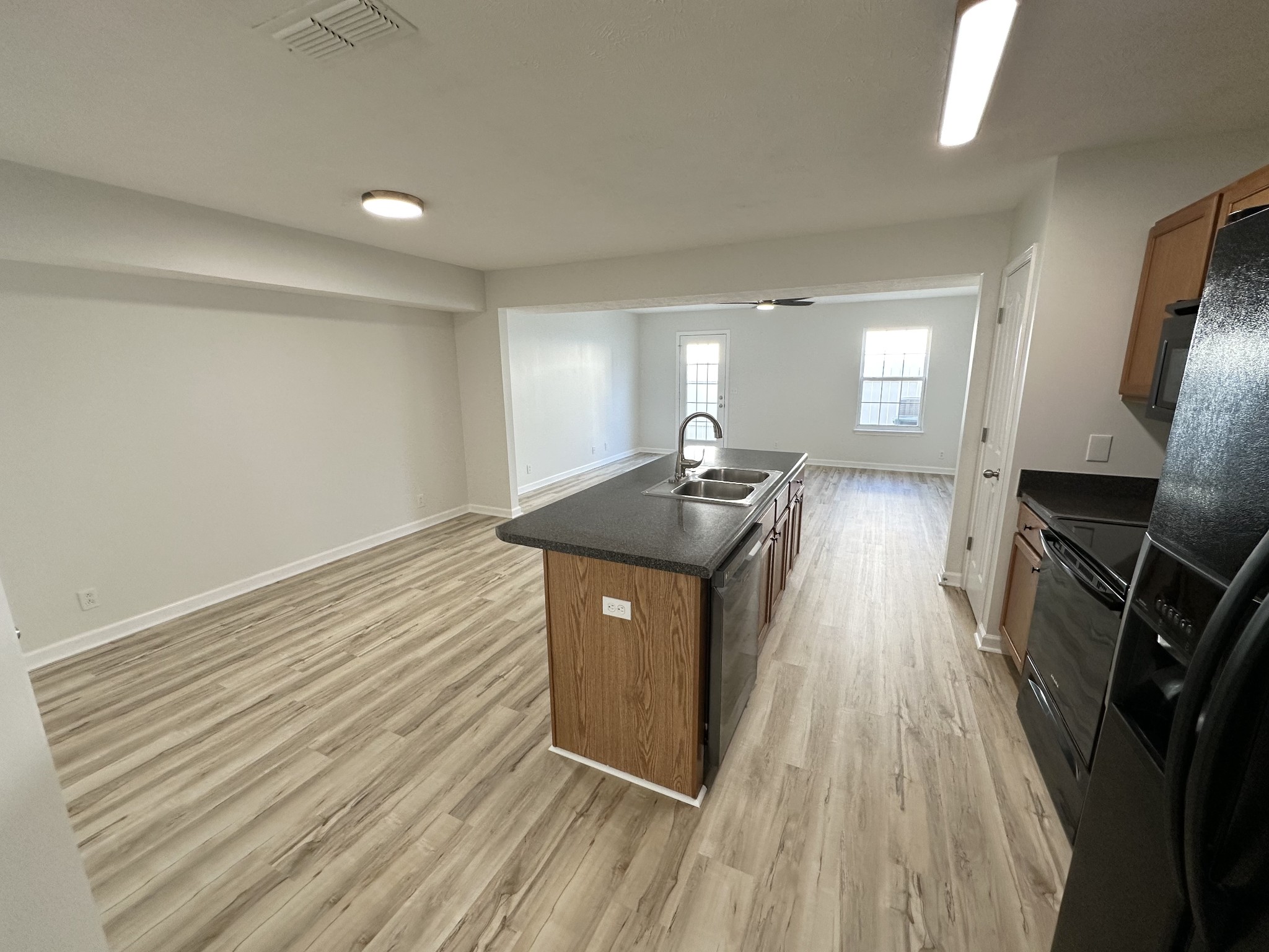 202 Latimer Drive Smyrna, TN 37167 - Photo 2 of 30 a kitchen with stainless steel appliances granite countertop a sink stove and wooden floor