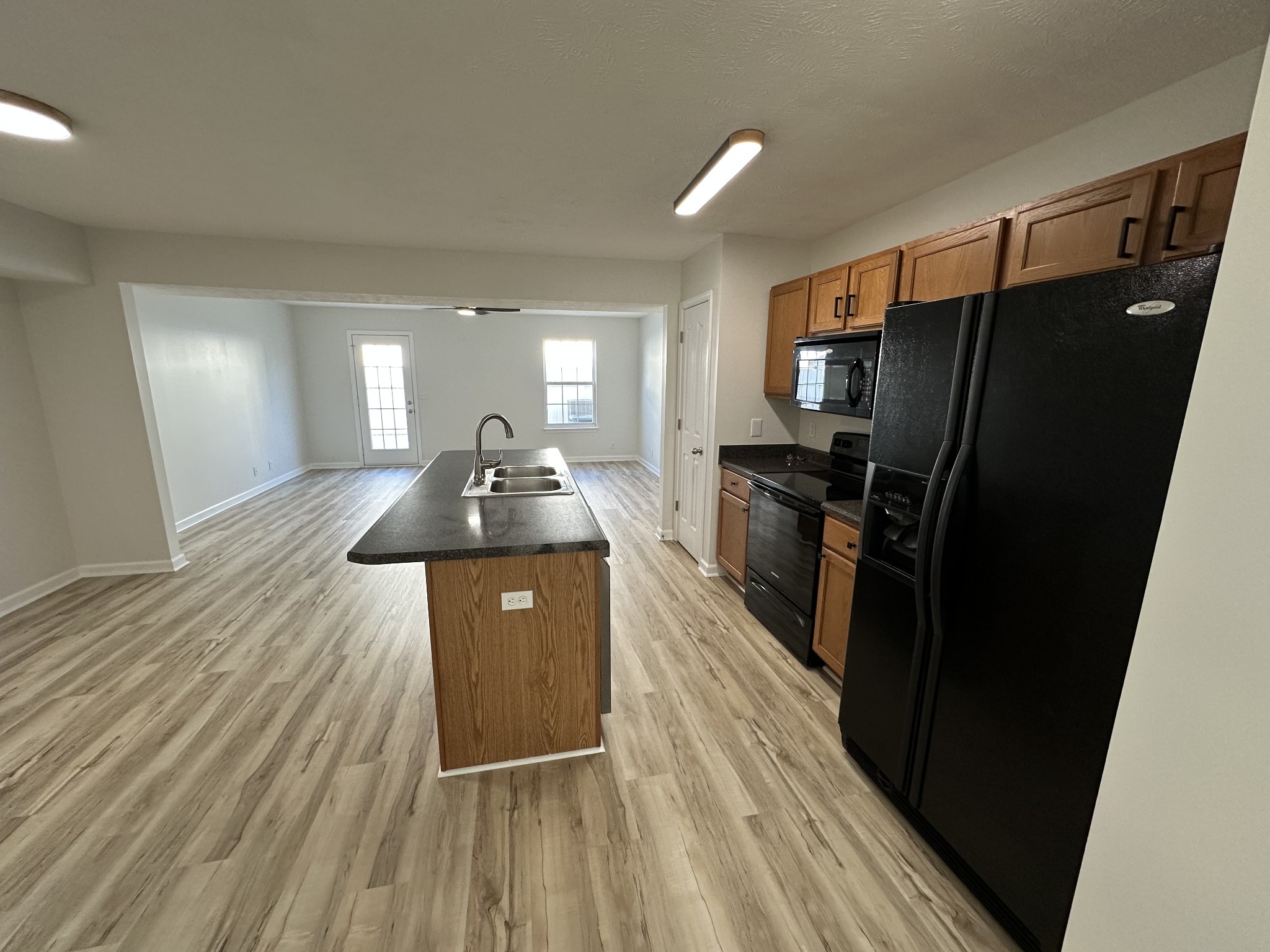 202 Latimer Drive Smyrna, TN 37167 - Photo 4 of 30 a kitchen with sink a refrigerator and wooden floor