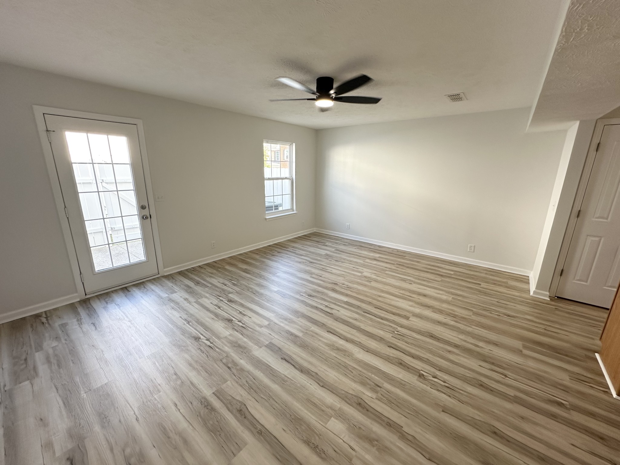 202 Latimer Drive Smyrna, TN 37167 - Photo 6 of 30 an empty room with wooden floor and windows