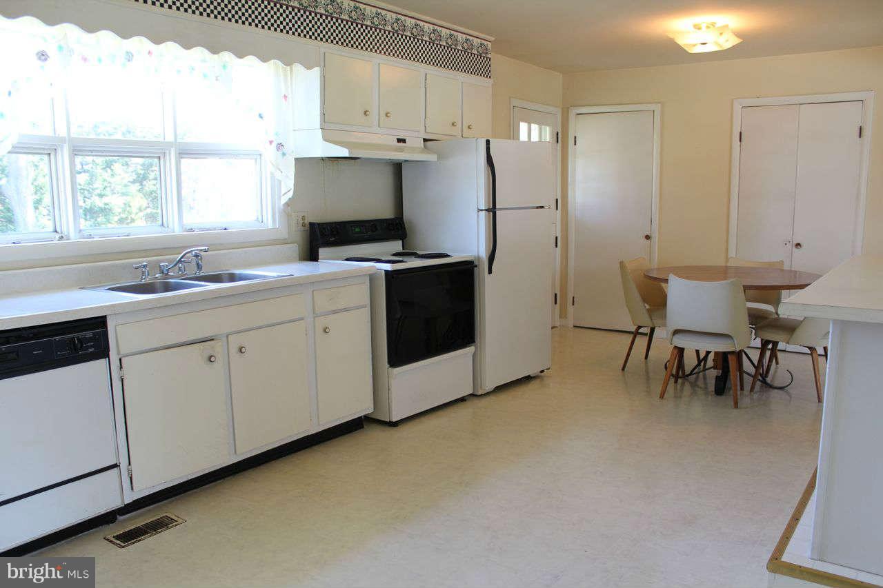 3055 Riverview Drive Riva, MD 21140 - Photo 11 of 30 a kitchen with cabinets and white appliances