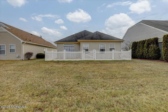 a large tree in front of a house