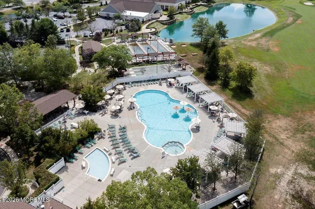 an aerial view of a house with outdoor space