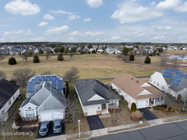 an aerial view of houses with yard