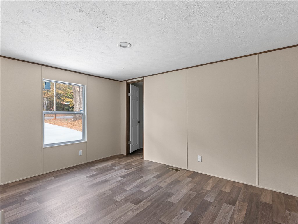 401 Mormon Church Road Seneca, SC 29678 - Photo 30 of 43 This airy room features durable flooring and a bright window, ready for personalization.