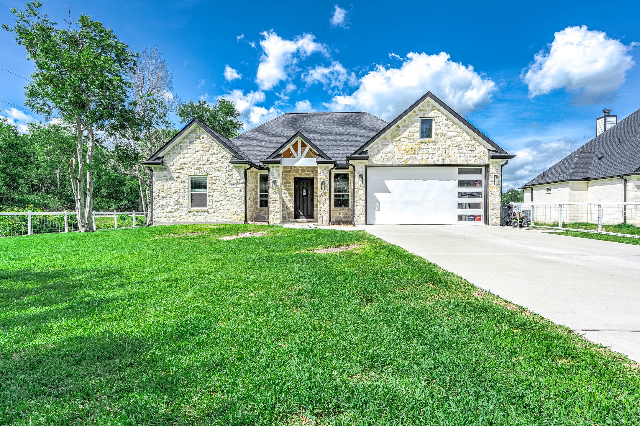 8032 Short Road Needville, TX 77461 - Photo 1 of 50 Welcome to 8032 Short Rd — a charming single-story home situated on a spacious 1-acre tract. This beautifully designed home features an attractive stone façade, modern finishes, a spacious driveway, attached garage, and a well-maintained lawn. Enjoy the perfect blend of peaceful country living and everyday convenience, with plenty of space to relax, entertain, and make your own.