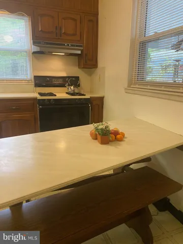 a kitchen with a stove and a refrigerator